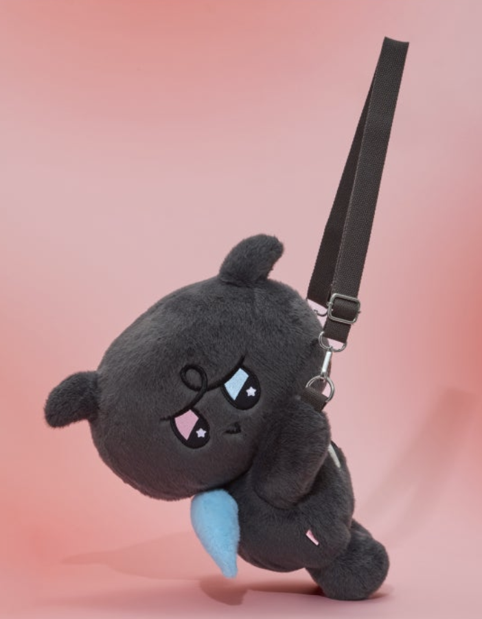 Black KKAMYO plush shoulder bag against a pink background